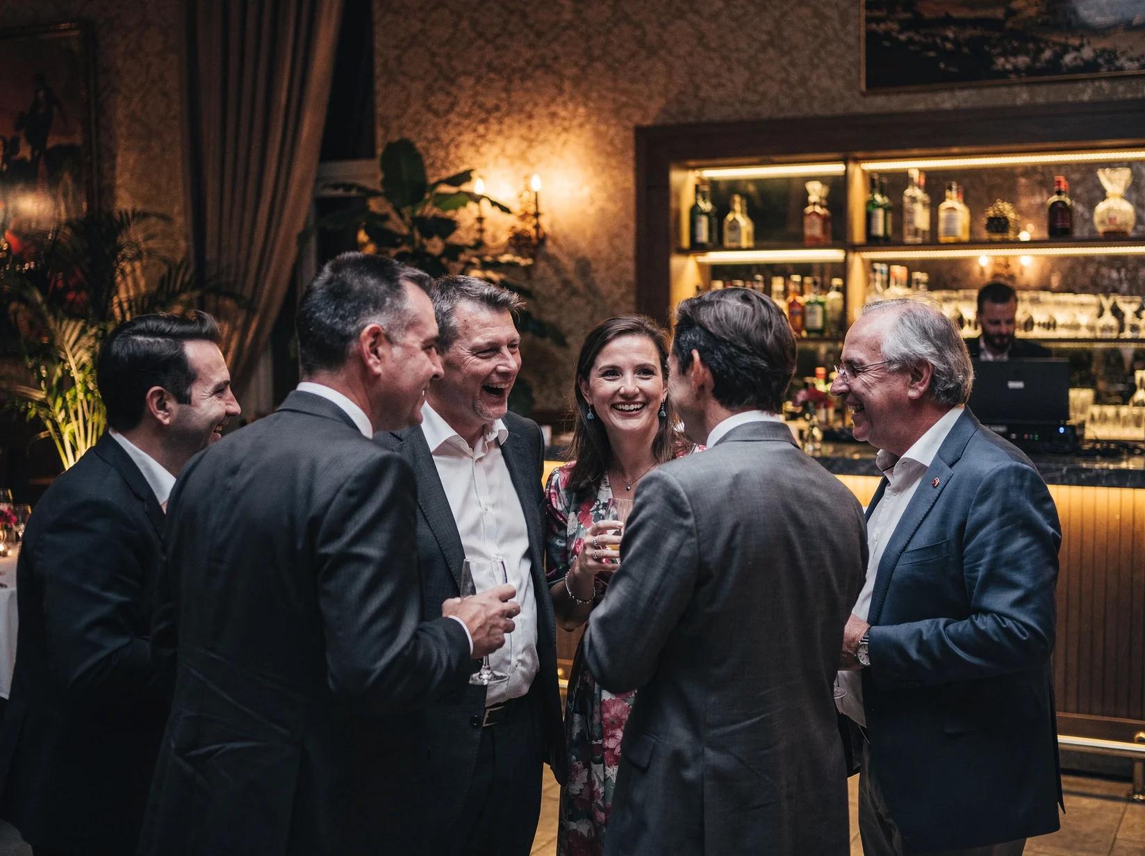 Reception guests enjoying conversation and the tasteful vibe set by a lounge DJ