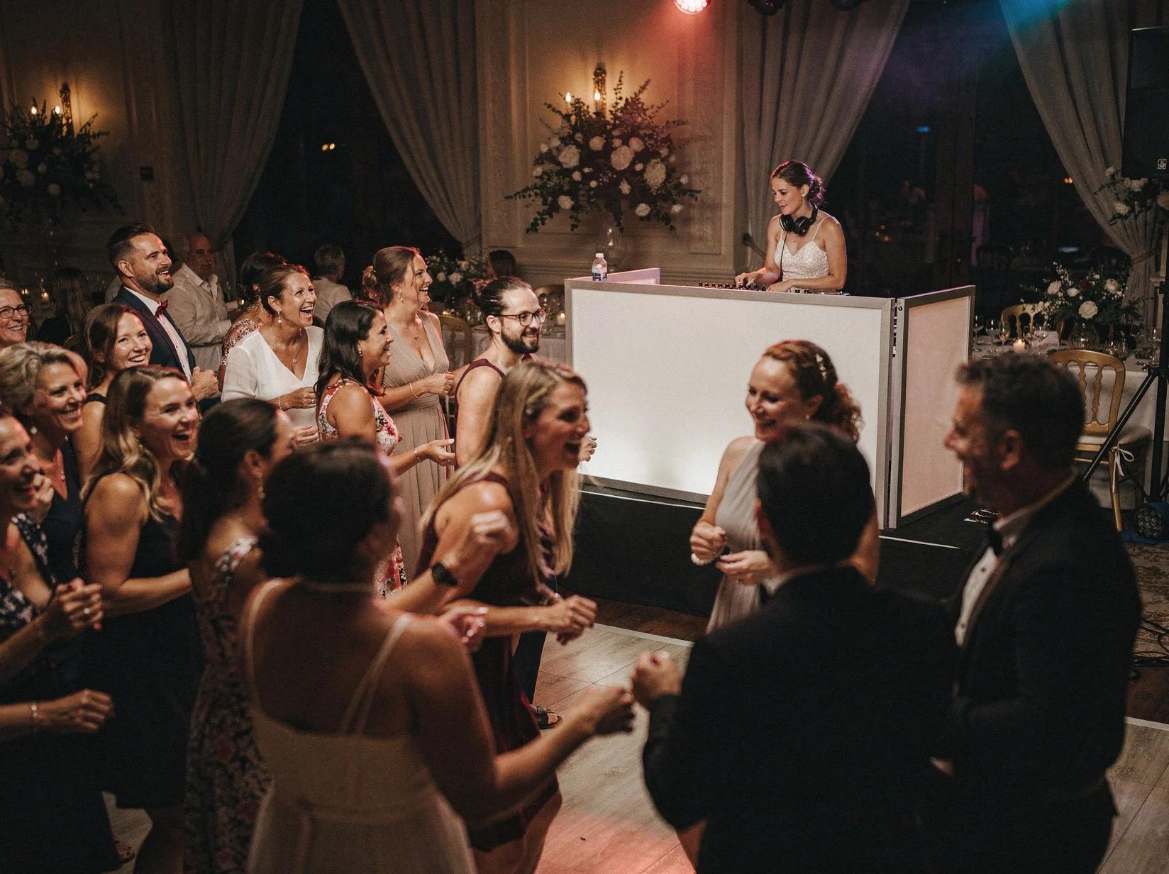 Romantic wedding reception venue illuminated by golden string lights and candles, perfect for booking a wedding DJ for an elegant celebration.